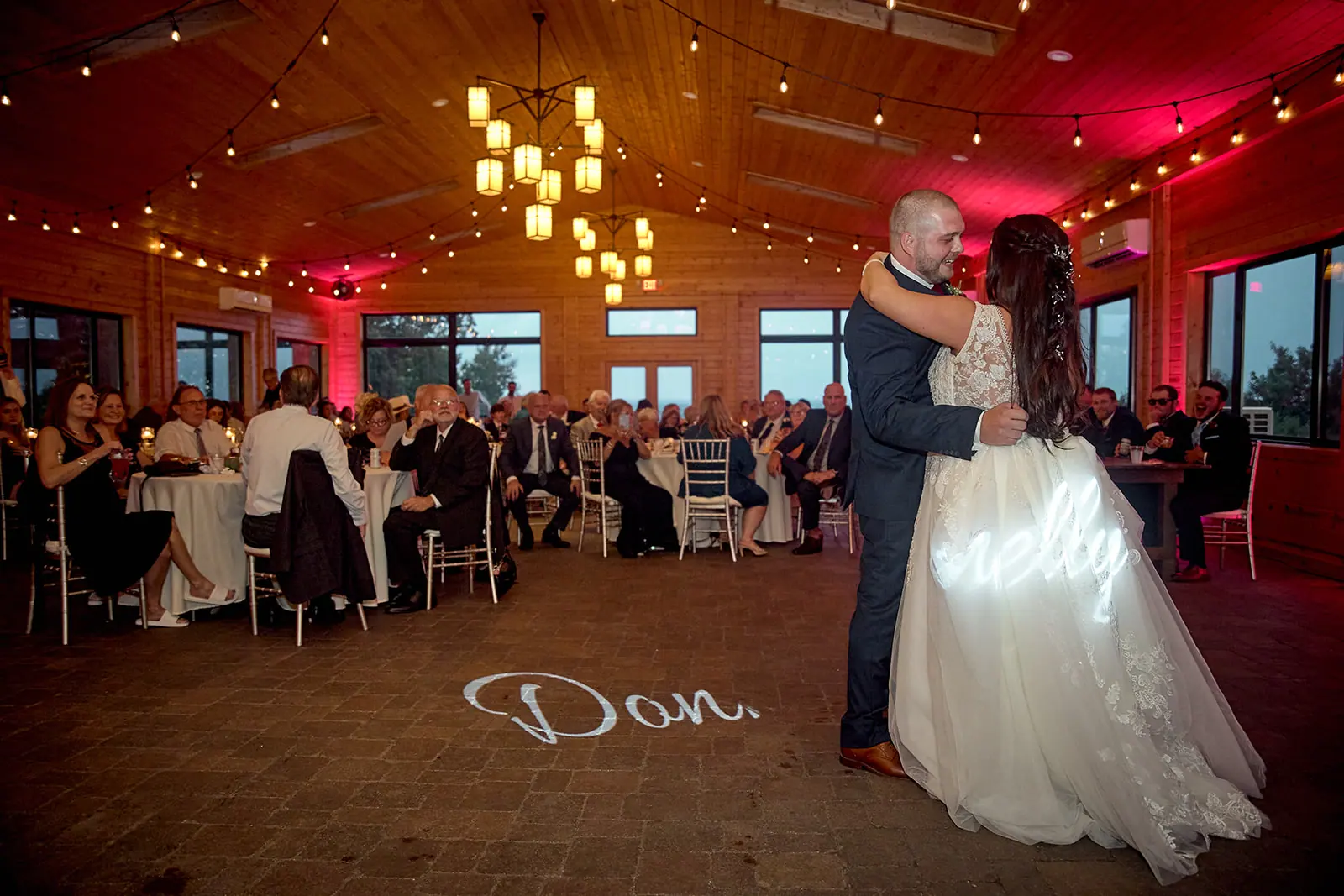 Groom bride dancing string lights name — Taylor & Mark's wedding at The Manor at Fire Tower Hill, Lewiston, MI