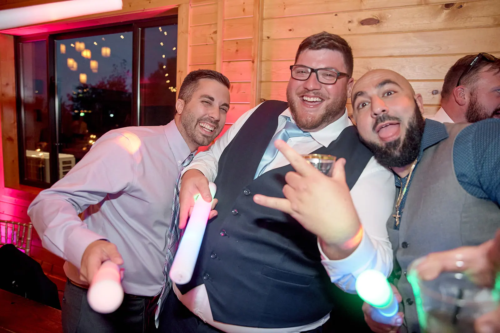 Groomsmen posing glow sticks reception — Taylor & Mark's wedding at The Manor at Fire Tower Hill, Lewiston, MI