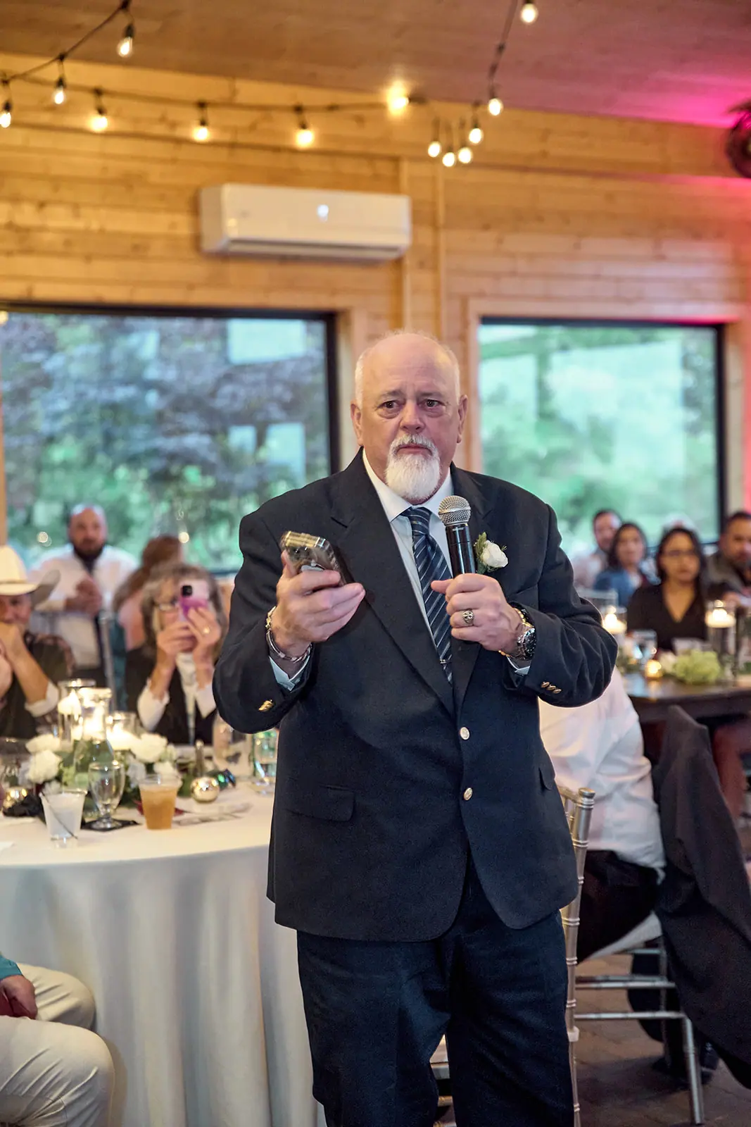 Older man giving toast microphone — Taylor & Mark's wedding at The Manor at Fire Tower Hill, Lewiston, MI